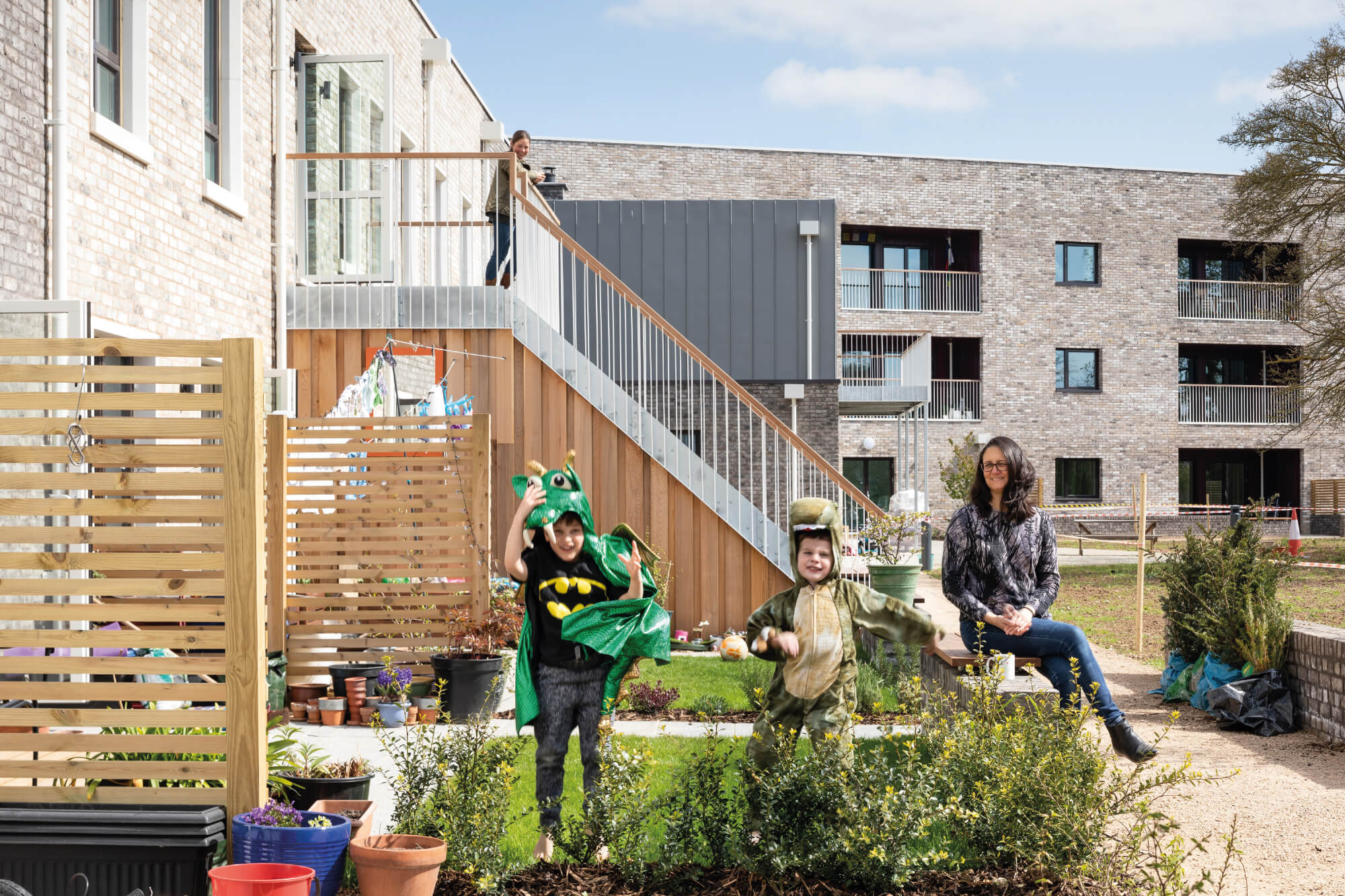 A family in their garden at Marmalade Lane