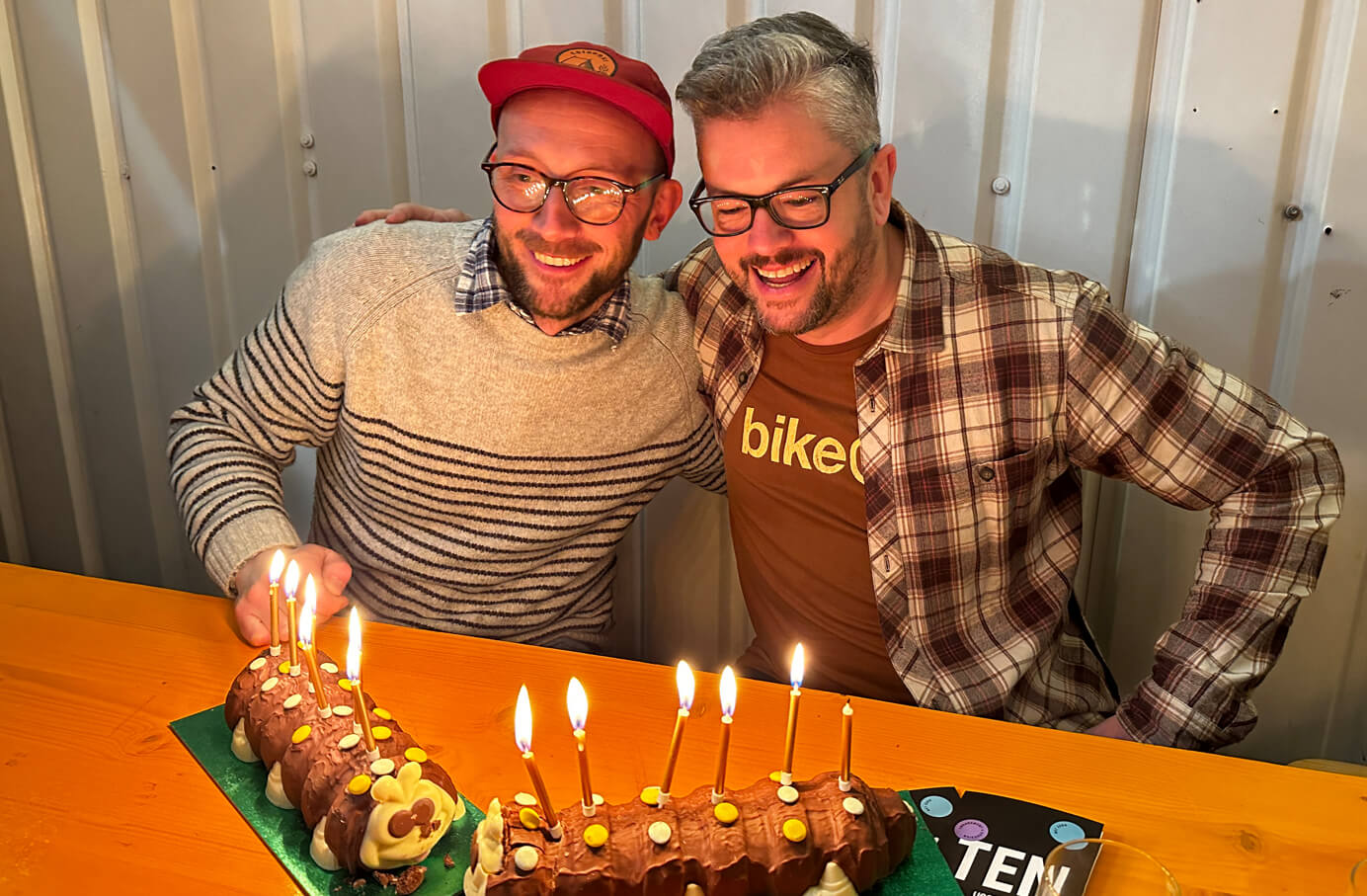 Neil and Jonny blowing the candles out on their birthday cake